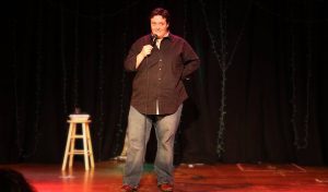 Photo of comedian Jess Miller on stage